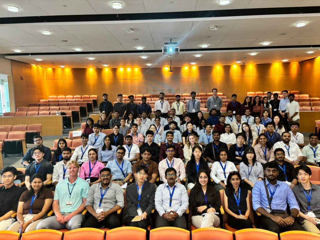 Students sitting in auditorium.