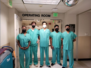 Team of MSEM students in scrubs at the Johns Hopkins Hospital. 