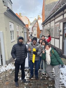 Students in a snow-covered alley in the town of Helsingor, Denmark.