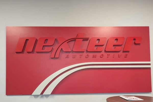 Nexteer Automotive sign in the Nexteer offices.