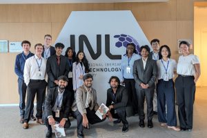 MSEM students in front of an INL sign at the Iberian Nanotechnology Laboratory