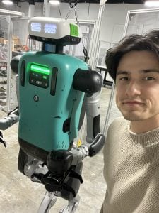 Tyler with robot at Agility Robotics.