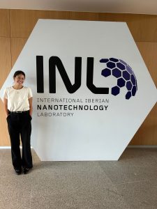 Elle Marine posing next to the Iberian Nanotechnology Laboratory sign.